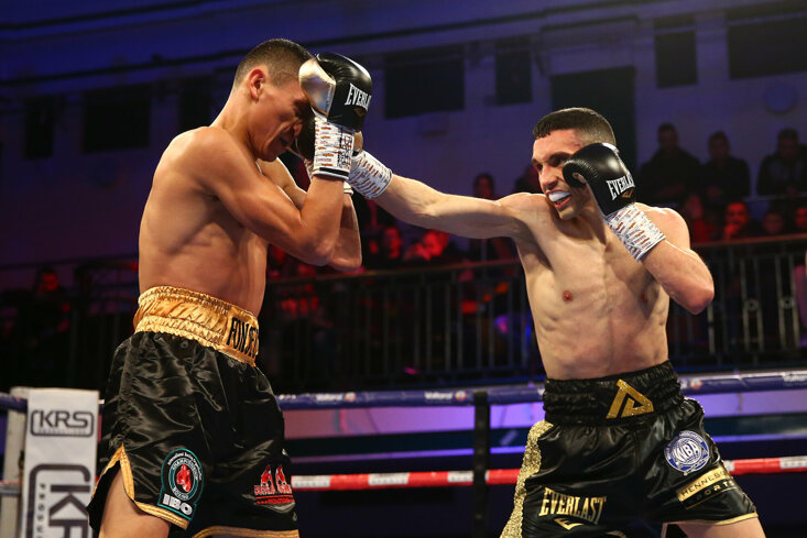 Dilmaghani catches Francisco Fonseca during an IBO super-featherweight world title fight in 2019 that ended in a draw