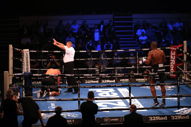 REFEREE MARCUS MCDONNELL COUNTS OUT DINU TO HAND DUBOIS THE WIN