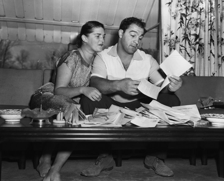 Marciano opening fan-mail with his wife, Barbara 