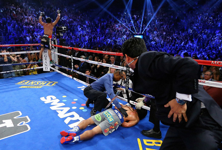 MARQUEZ CELEBRATES FINALLY GETTING THE BETTER OF A PRONE PACQUIAO