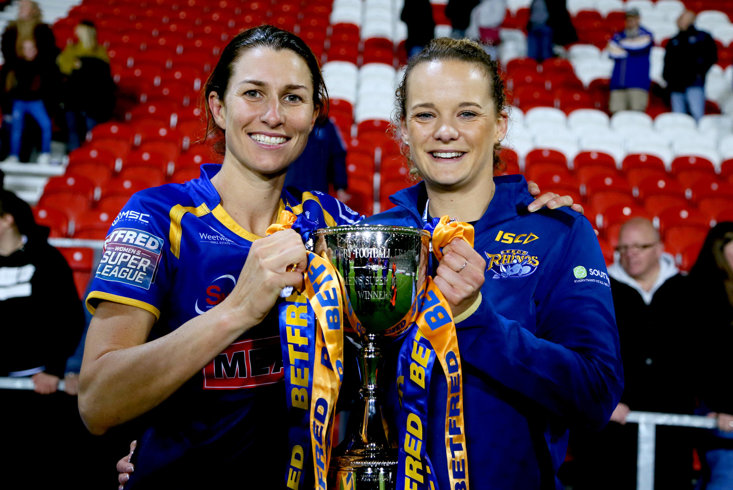 Courtney Winfield-Hill and Lois Forsell (right) celebrate Leeds' Grand Final win in 2019