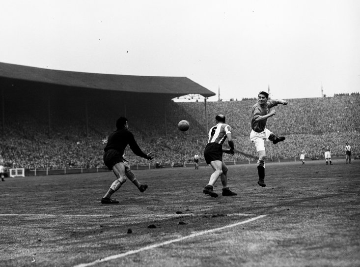 Milburn in action for England against Germany