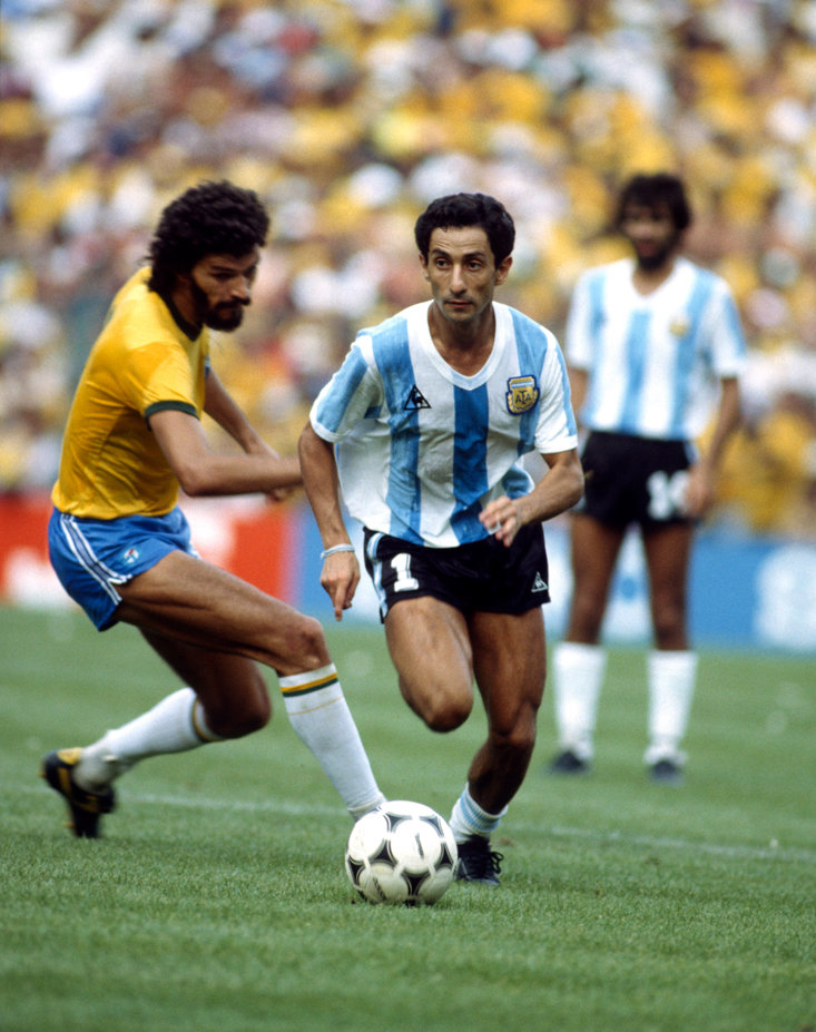 SOCRATES UP AGAINST OSSIE ARDILES AT THE 1982 WORLD CUP