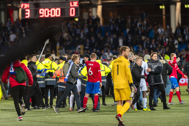 Fans flood the pitch in Helsinki after Finland secure Euro 2020 qualification