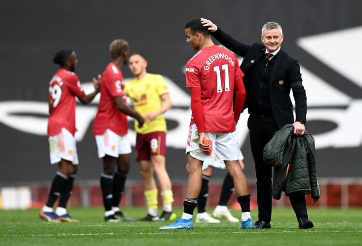 GREENWOOD IS CONGRATULATED BY OLE GUNNAR SOLSKJAER AT FULL-TIME