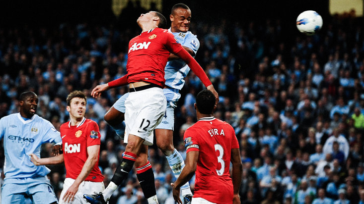 Kompany in action during a Manchester derby
