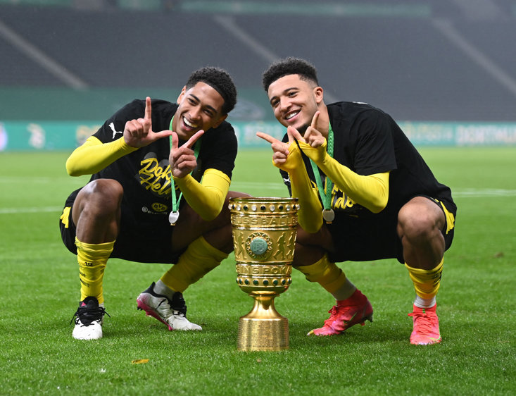 Jude Bellingham with Jadon Sancho and the DFB-Pokal trophy