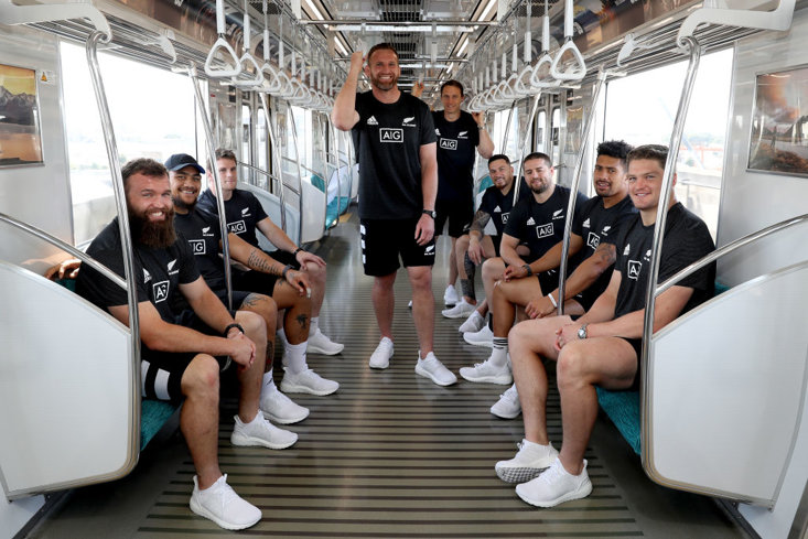 Liam Coltman, Ofa Tuungafasi, Matt Todd, Kieran Read, Ben Smith, Sonny Bill Williams, Dane Coles, Ardie Savea and Scott Barrett of the All Blacks host Japanese media on a train to the launch of the New Zealand Says 39 campaign in Kashiwanoha, Japan. In Japanese, ‘39’ means ‘San Kyu’ and on behalf of New Zealand we say ‘Thank You’ for hosting us.