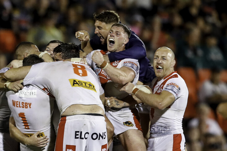 LEWIS DODD IS MOBBED AFTER SCORING THE GOLDEN POINT